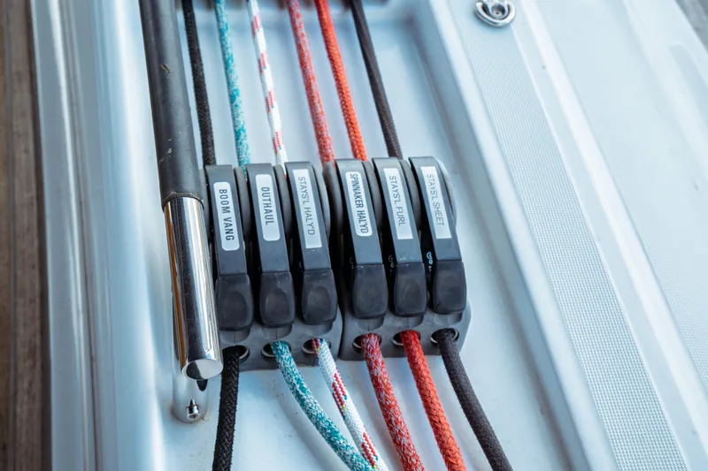 Slide: The Image of Close-up of sailing ropes and clutches on a 2016 Beneteau Oceanis 60 yacht. - 58