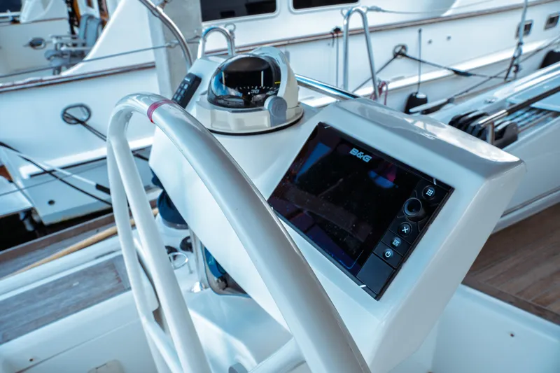 Slide: The Image of Steering console of 2016 Beneteau Oceanis 60 yacht with navigation equipment. - 60