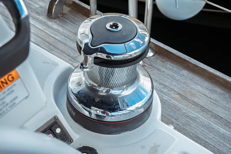 Slide: The Image of Close-up of a winch on a 2016 Beneteau Oceanis 60 sailboat deck. - 62