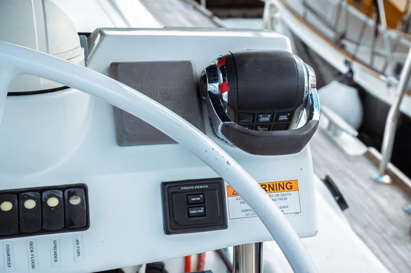 Slide: The Image of Control panel of a 2016 Beneteau Oceanis 60 yacht with steering wheel and throttle. - 66