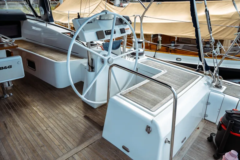 Slide: The Image of Cockpit of 2016 Beneteau Oceanis 60 yacht with wooden deck and steering wheel. - 69