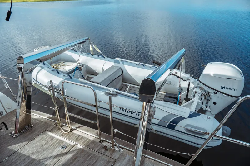 Slide: The Image of Inflatable dinghy with Tohatsu motor on Beneteau Oceanis 60 yacht, 2016 model. - 71