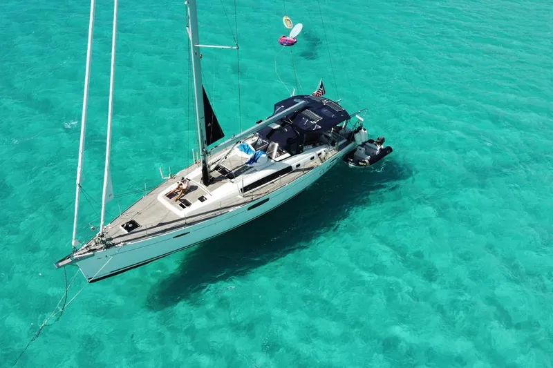 Slide: The Image of 2016 Beneteau Oceanis 60 yacht sailing on clear turquoise waters. - 72