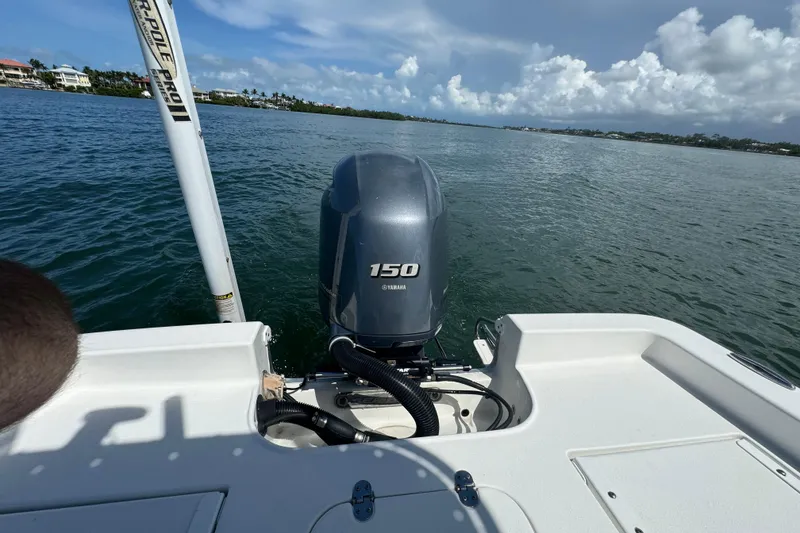 Slide: The Image of 2016 Sea Hunt BX 20 BR boat with Yamaha 150 engine on calm water. - 14