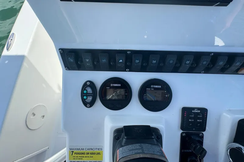 Slide: The Image of 2016 Sea Hunt BX 20 BR boat dashboard with Yamaha gauges and control switches. - 16