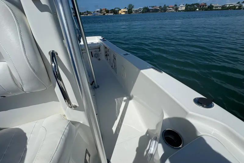 Slide: The Image of 2016 Sea Hunt BX 20 BR boat interior with water view and seating area. - 18