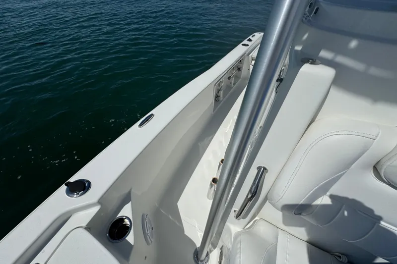 Slide: The Image of 2016 Sea Hunt BX 20 BR boat interior with white seating and stainless steel fixtures. - 19