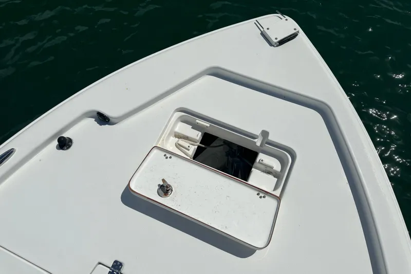 Slide: The Image of 2016 Sea Hunt BX 20 BR boat deck with open storage compartment. - 23