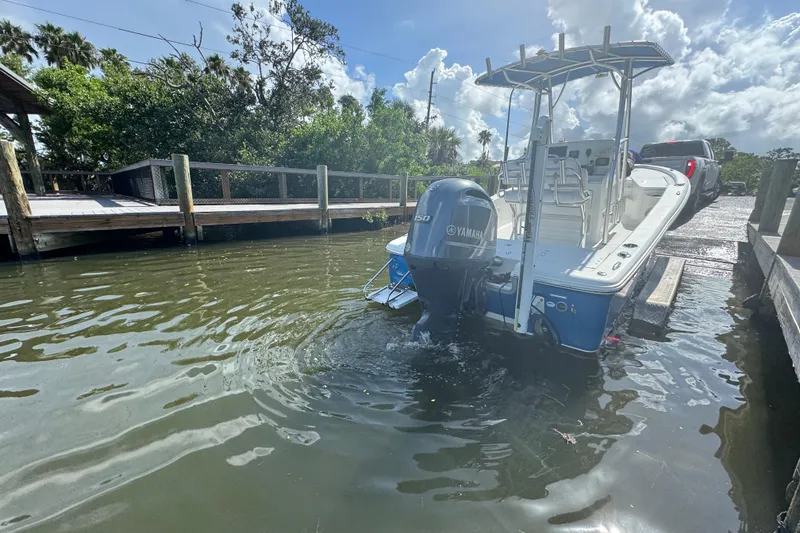 Slide: The Image of 2016 Sea Hunt BX 20 BR boat being launched from a trailer at a dock. - 26