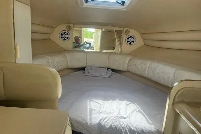 Slide: The Image of Interior cabin of 2000 Sea Ray 270 Sundancer with cozy bed and skylight. - 10