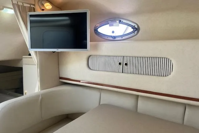Slide: The Image of Interior of 2000 Sea Ray 270 Sundancer with TV and porthole window. - 15