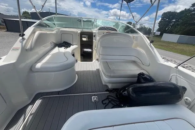 Slide: The Image of 2000 Sea Ray 270 Sundancer boat interior with seating and open cockpit view. - 2