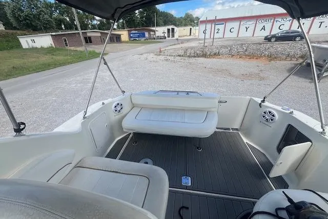 Slide: The Image of 2000 Sea Ray 270 Sundancer boat interior with seating and speakers. - 3