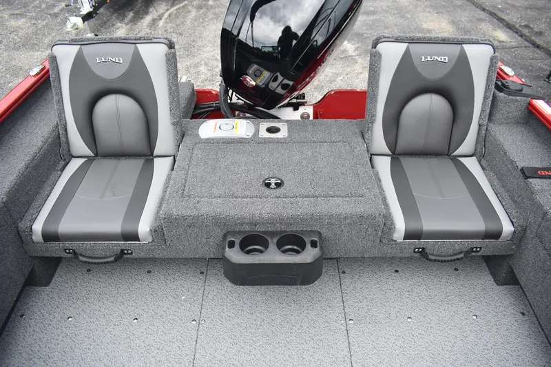 Slide: The Image of 2026 Lund 1775 Adventure Sport boat interior with gray seating and storage compartments. - 10