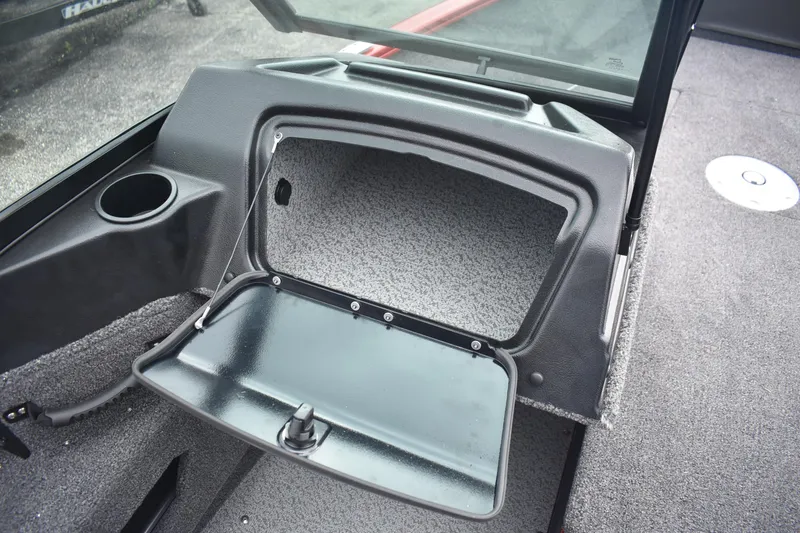 Slide: The Image of 2026 Lund 1775 Adventure Sport boat interior storage compartment with open hatch. - 12