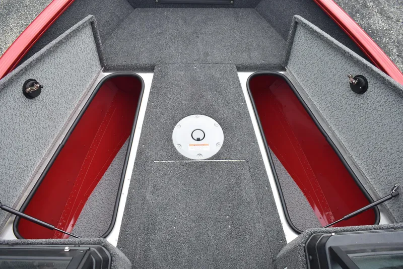 Slide: The Image of 2026 Lund 1775 Adventure Sport boat interior with open storage compartments. - 13