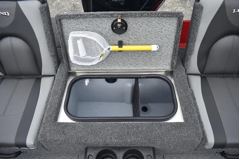 Slide: The Image of 2026 Lund 1775 Adventure Sport boat interior with storage compartment and fishing net. - 14