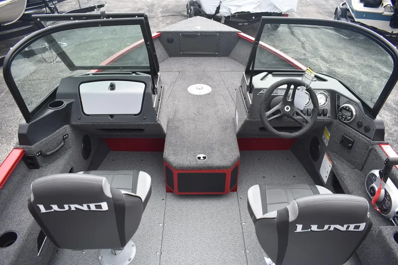 Slide: The Image of 2026 Lund 1775 Adventure Sport boat interior with dual seats and steering console. - 7