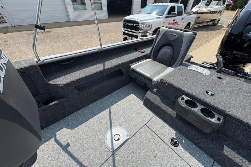 Slide: The Image of 2026 Lund 1875 Impact XS Sport boat interior with seating and storage compartments. - 23