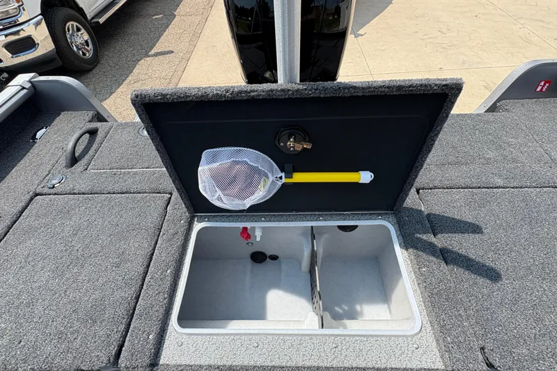 Slide: The Image of 2026 Lund 1875 Impact XS Sport boat storage compartment with net and handle. - 28
