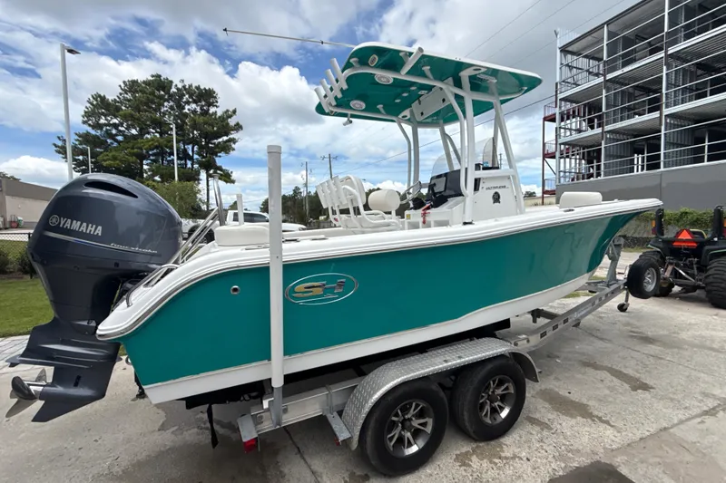 Slide: The Image of 2021 Sea Hunt Ultra 219 boat on trailer with Yamaha outboard motor. - 10