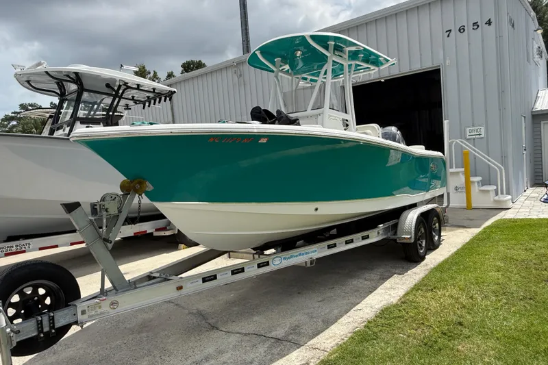 Slide: The Image of 2021 Sea Hunt Ultra 219 boat on trailer outside a storage facility. - 20
