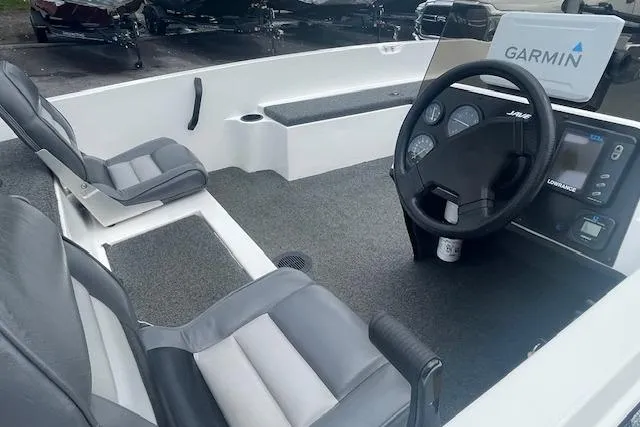 Slide: The Image of 1996 Javelin 369SE boat interior with Garmin navigation system and dual seats. - 6