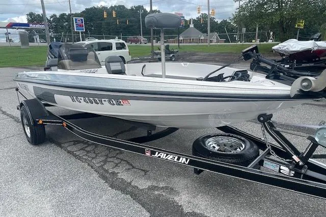 Slide: The Image of 1996 Javelin 369SE boat on trailer in parking lot. - 8