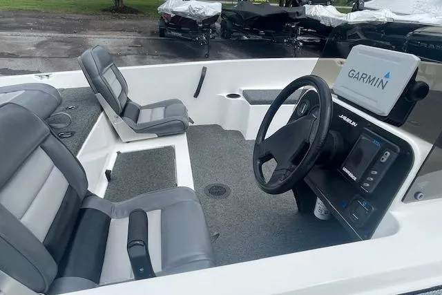 Slide: The Image of 1996 Javelin 369SE boat interior with Garmin navigation system and gray seating. - 9