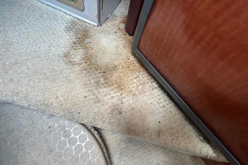 Slide: The Image of Stained carpet in 2005 Sea Ray 260 Sundancer boat interior. - 17