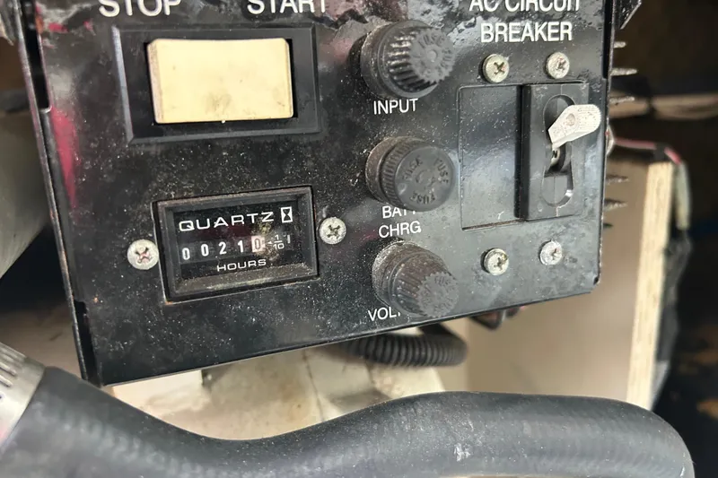 Slide: The Image of Control panel of a 2005 Sea Ray 260 Sundancer boat with hour meter reading 210. - 23