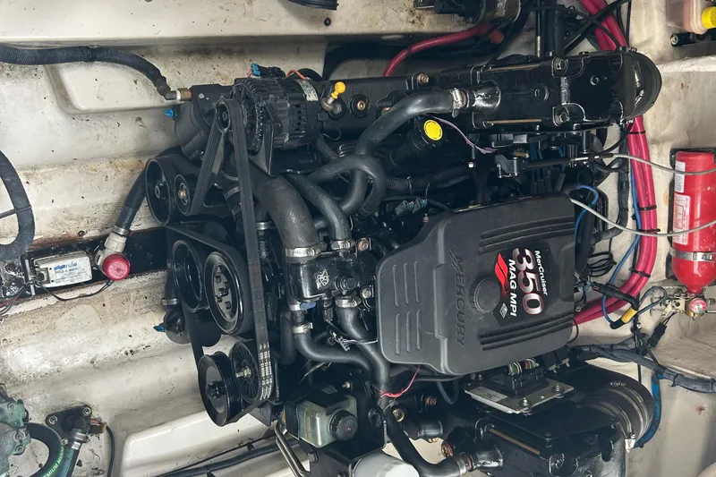 Slide: The Image of Engine of a 2005 Sea Ray 260 Sundancer boat, featuring a MerCruiser 350 MAG MPI. - 25