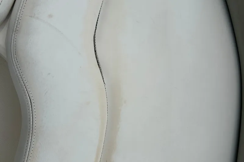 Slide: The Image of Close-up of worn upholstery on 2005 Sea Ray 260 Sundancer boat seat. - 27