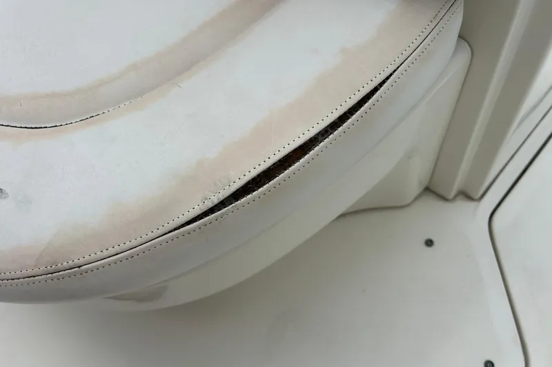 Slide: The Image of Worn seat cushion on 2005 Sea Ray 260 Sundancer boat, showing visible damage. - 29