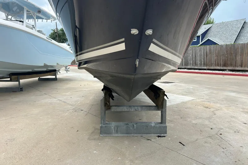 Slide: The Image of 2005 Sea Ray 260 Sundancer boat on a stand, viewed from the front. - 31