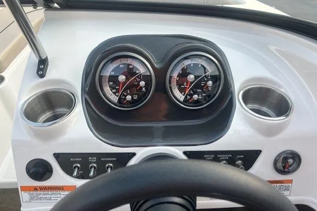 Slide: The Image of Dashboard of a 2016 Bayliner 175 Bowrider boat with gauges and controls. - 13