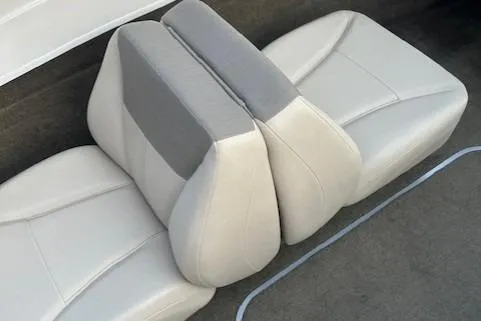 Slide: The Image of 2016 Bayliner 175 Bowrider interior seats, featuring gray and white upholstery. - 4