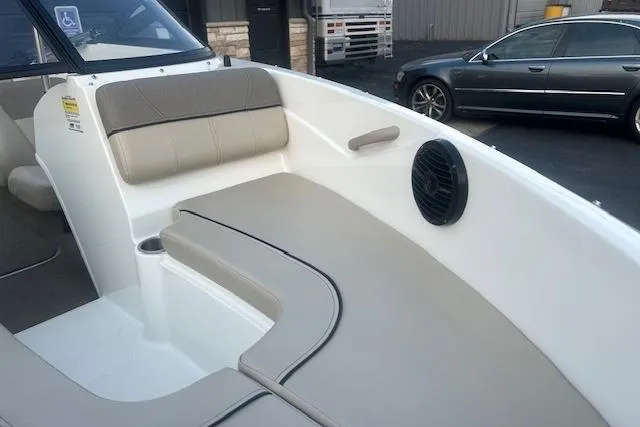 Slide: The Image of 2016 Bayliner 175 Bowrider interior with beige seating and speaker. - 8
