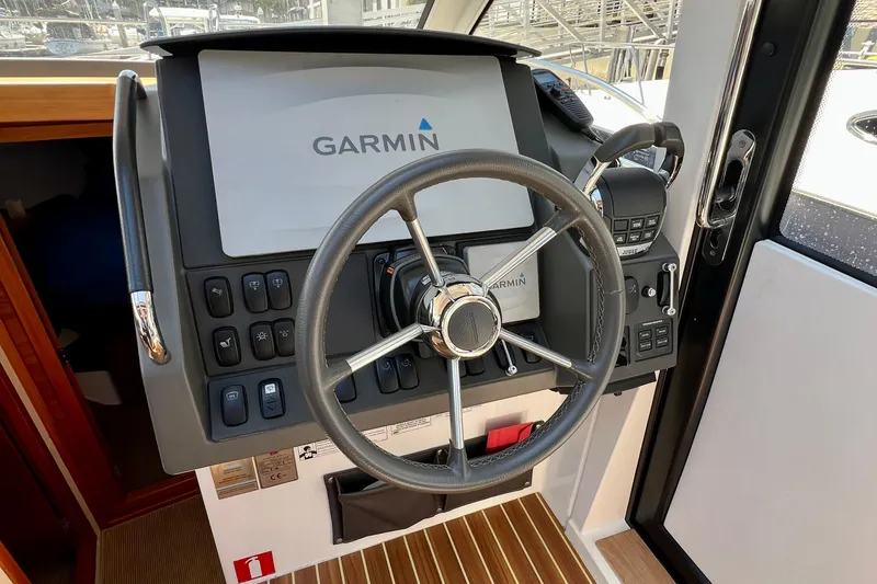 Slide: The Image of Steering console of 2018 Nimbus 365 Coupe with Garmin navigation system. - 92