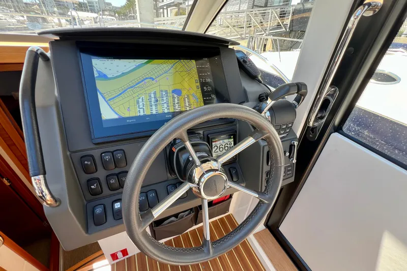 Slide: The Image of Steering wheel and navigation system of 2018 Nimbus 365 Coupe boat. - 93