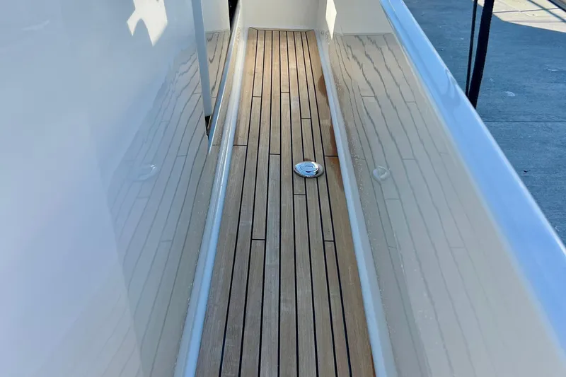 Slide: The Image of Teak deck of 2018 Nimbus 365 Coupe boat, showcasing sleek design and craftsmanship. - 34