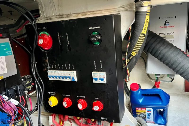 Slide: The Image of Electrical panel and components inside a 2018 Nimbus 365 Coupe boat engine room. - 59