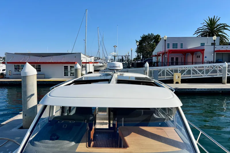Slide: The Image of Nimbus 365 Coupe 2018 docked at marina with clear blue sky. - 29