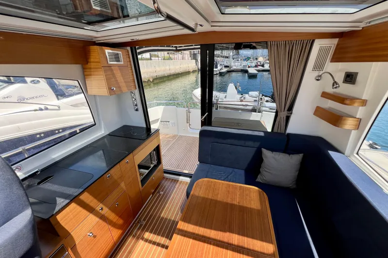 Slide: The Image of Interior of 2018 Nimbus 365 Coupe yacht with modern kitchen and seating area. - 69