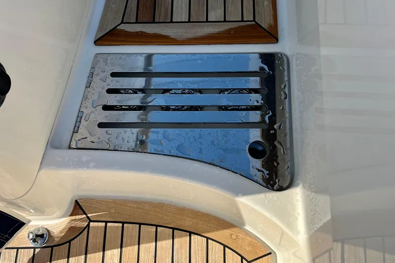 Slide: The Image of Stainless steel deck detail on 2018 Nimbus 365 Coupe, featuring wood accents and water droplets. - 36