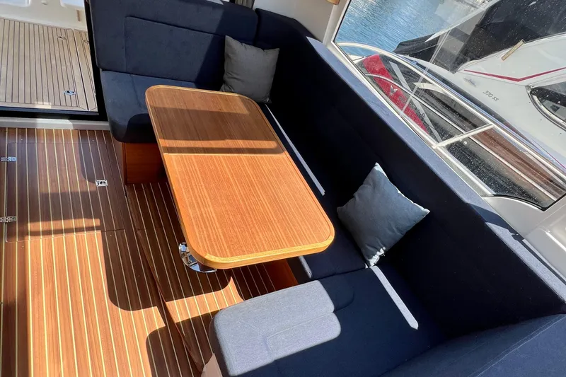 Slide: The Image of Interior of 2018 Nimbus 365 Coupe with wooden table and blue seating. - 71