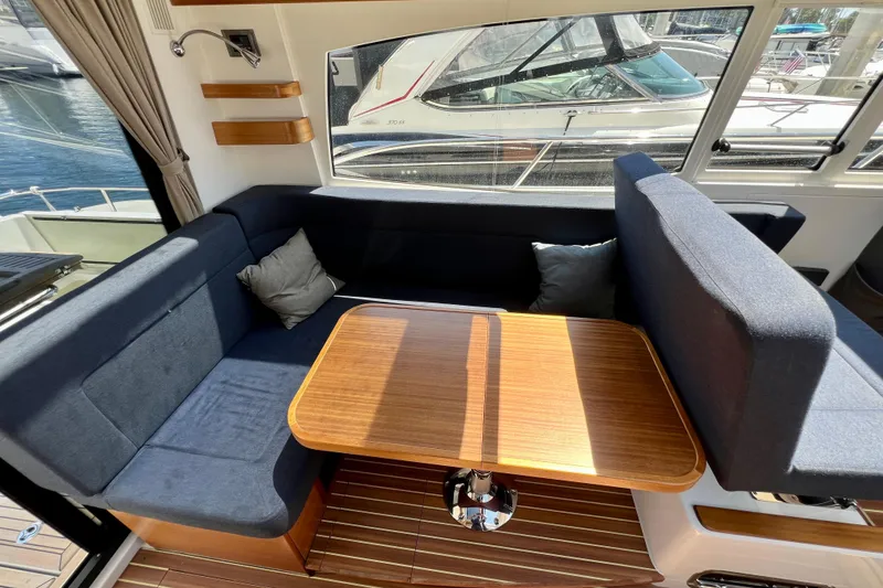 Slide: The Image of Interior of 2018 Nimbus 365 Coupe with cozy seating and wooden table. - 73