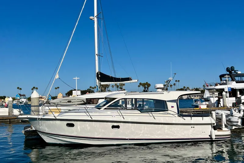 Slide: The Image of 2018 Nimbus 365 Coupe yacht docked in a sunny marina, clear blue sky. - 21