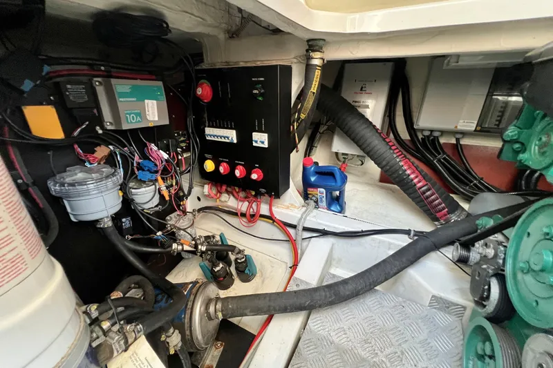 Slide: The Image of Engine room of a 2018 Nimbus 365 Coupe with various mechanical components. - 58