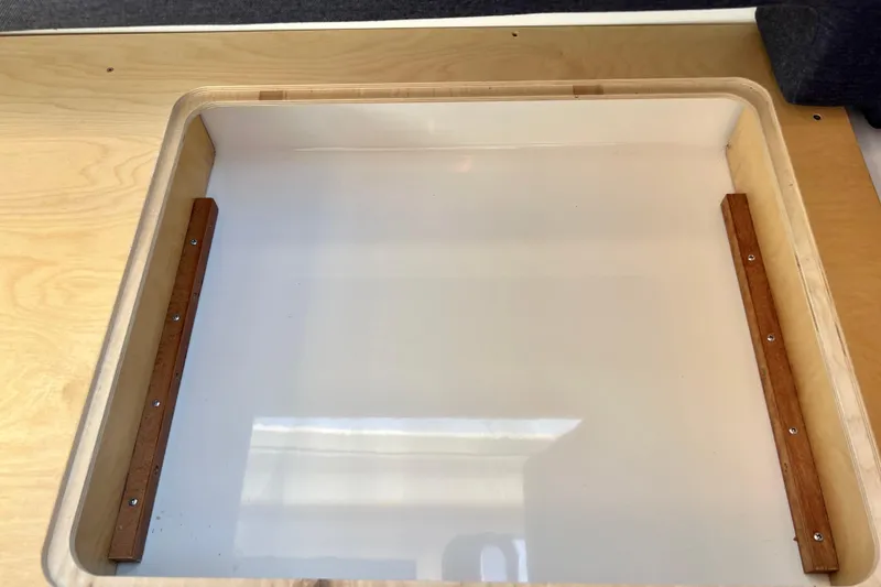 Slide: The Image of Wooden storage compartment in 2018 Nimbus 365 Coupe boat interior. - 127